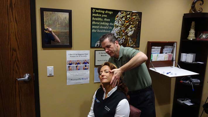 Chiropractor Oak Creek WI Daniel Hyatt Giving an Adjustment
