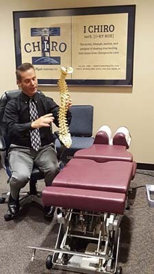 Chiropractor Oak Creek WI Daniel Hyatt With Spinal Display