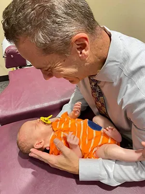 Chiropractor Oak Creek WI Daniel Hyatt Adjusting Infant