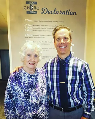 Chiropractor Oak Creek WI Daniel Hyatt With Elderly Patient
