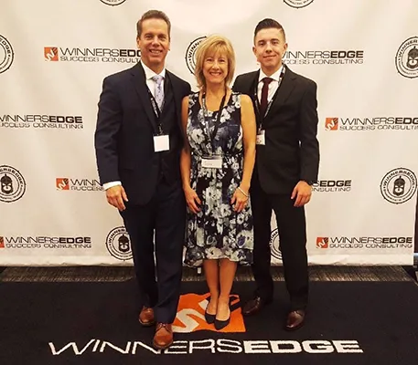 Chiropractor Oak Creek WI Daniel Hyatt With Team At Award Ceremony